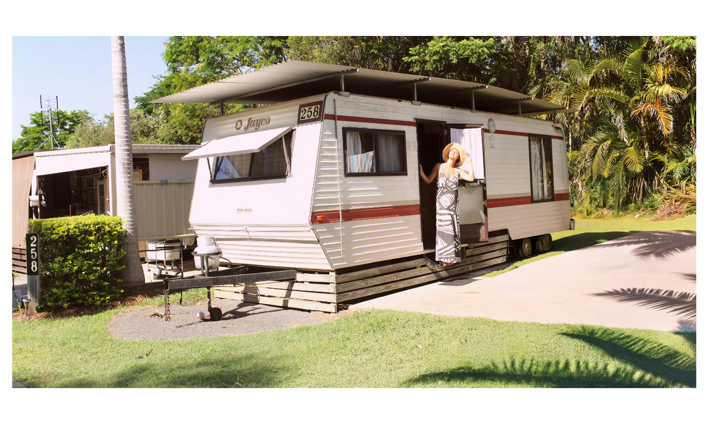Lady stepping out of Caravan